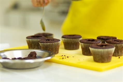 Premium Photo | The process of making chocolate cupcakes with sweet ...