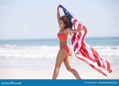 Woman In Bikini With American Flag Walking On The Beach Stock Photo Image Of Calm Escapism
