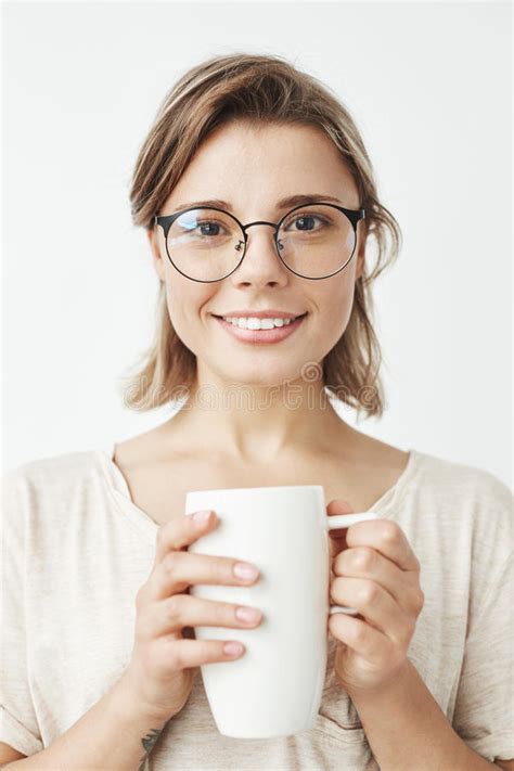 Cute Beautiful Natural Brunette Girl Cleaning Face With Cotton Sponge Smiling Looking At Camera