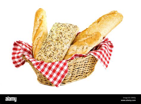 Variety Of Different Freshly Baked Bread In Basket Isolated Over White