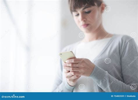 Young Woman Text Messaging With Her Mobile Stock Image Image Of