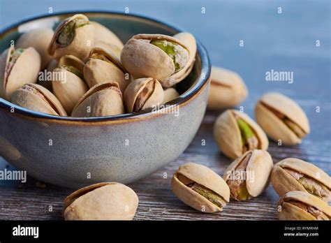 Closeup Of Pistachios In Wooden Bowl Hi Res Stock Photography And