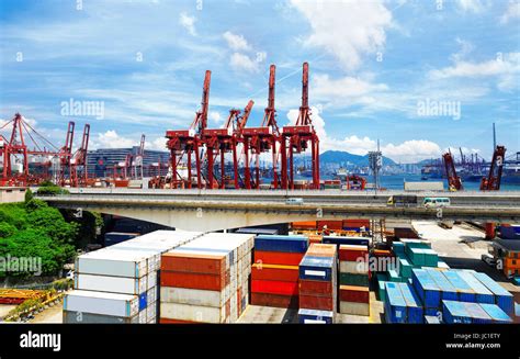 Port Warehouse With Containers And Industrial Cargoes At Day Stock