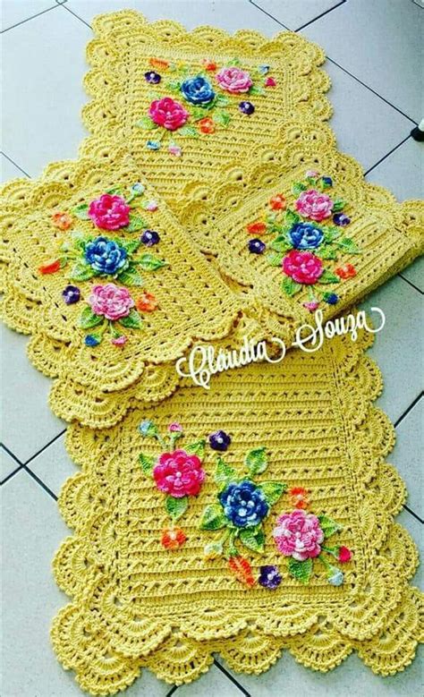 Yellow Crocheted Placemats With Flowers On Them Are Sitting On The Floor