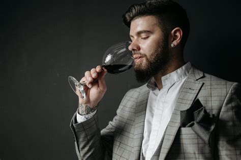 Man In Gray Suit Holding Wine Glass · Free Stock Photo