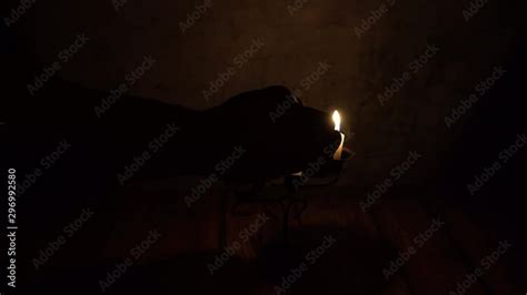 Vidéo Stock Hand Of A Man In A Dark Room Extinguishing Candles With His Fingertips Adobe Stock