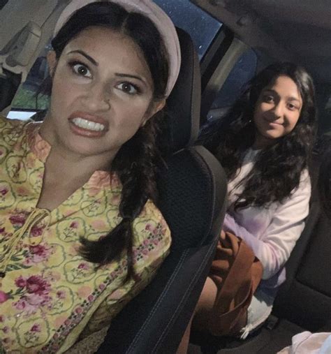 Three Women Sitting In The Back Seat Of A Car One With A Surprised