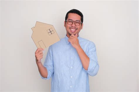 Premium Photo Adult Asian Man Smiling Happy While Holding A House