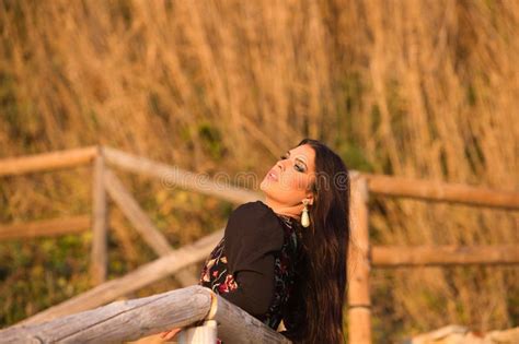 Spanish Woman Brunette And Beautiful Flamenco Dancer With Typical Flamenco Dancing Costume