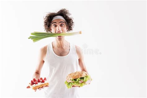 Hungry Skinny Guy Eating Healthy Onion Stock Photos Free And Royalty