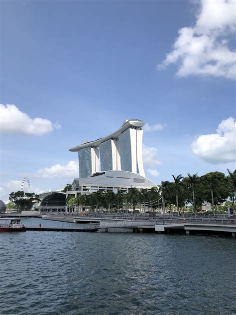 White Concrete Building Near Body Of Water During Daytime Photo Free סינגפור Image On Unsplash