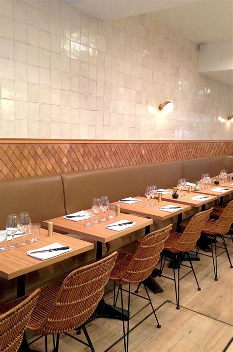 A Long Table With Place Settings And Wine Glasses On It In The Middle