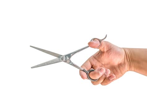 Premium Photo Cropped Hand Holding Scissors Against White Background