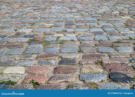 An Old Stoneblock Pavement Cobbled With Rectangular Granite Blocks