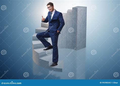 The Businessman Climbing Career Ladder In Business Concept Stock Photo