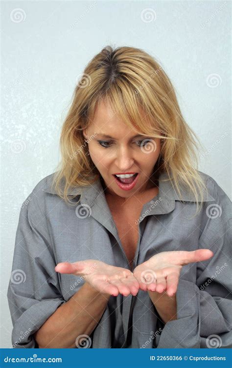 Beautiful Blonde Looks Surprisingly At Her Hands Stock Photo Image Of