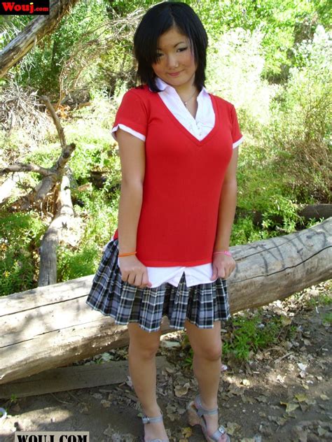 Hot Asian Babe Poses In Her Short Skirt And Flashes Her Lingerie Outdoors Photos