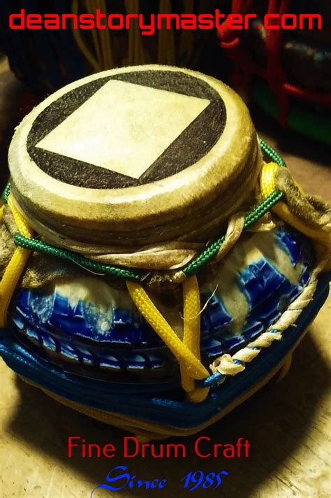 A Drum Sitting On Top Of A Blue And White Plate