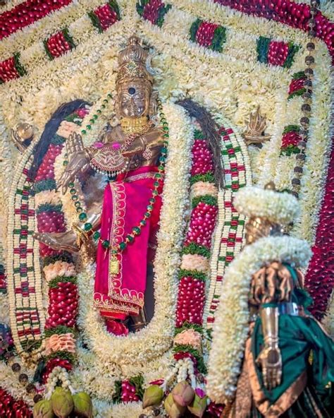 The Statue Is Decorated With Flowers And Other Decorations