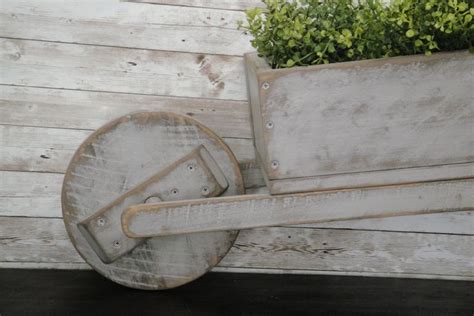 Rustic Decorative Wheelbarrow Planter Etsy Wheelbarrow Planter Wheelbarrow Rustic Wheelbarrows