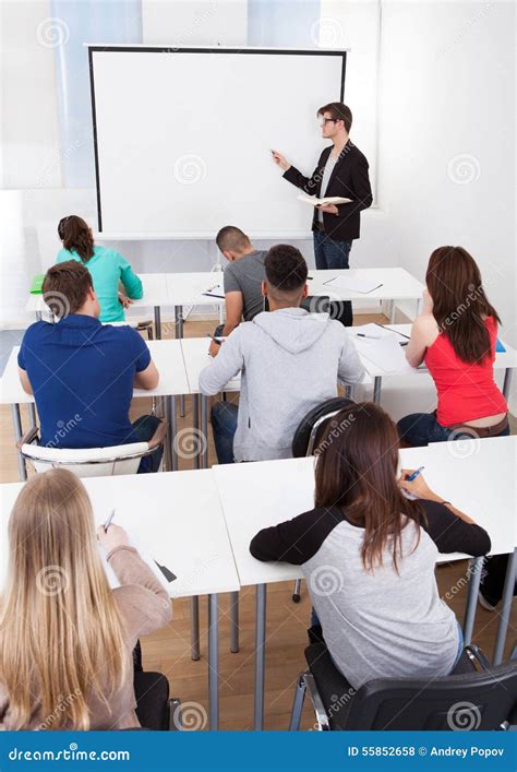 Teacher Teaching College Students in Classroom Stock Photo - Image of ...