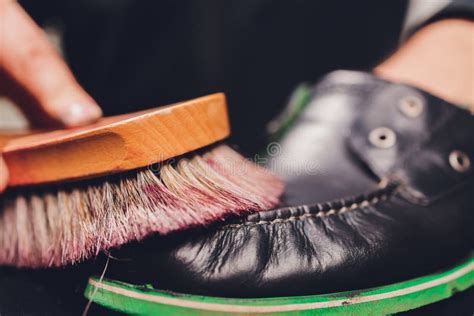 A Man Brushes Paint On Shoes Blue Shoe Polish Painted Blue Leather