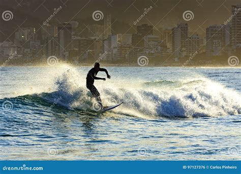 Surfing on Ipanema beach editorial photo. Image of arpoador - 97127376