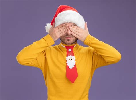 Free Photo Young Caucasian Man Wearing Christmas Hat And Tie Covering