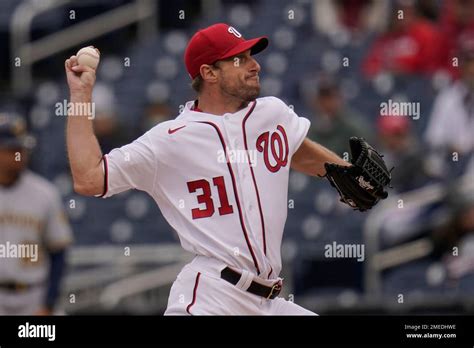 Washington Nationals Starting Pitcher Max Scherzer Throws A Pitch To