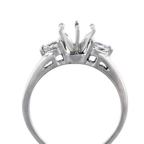 Platinum Engagement Ring Mounting With Pear Shape Diamond Side Stones