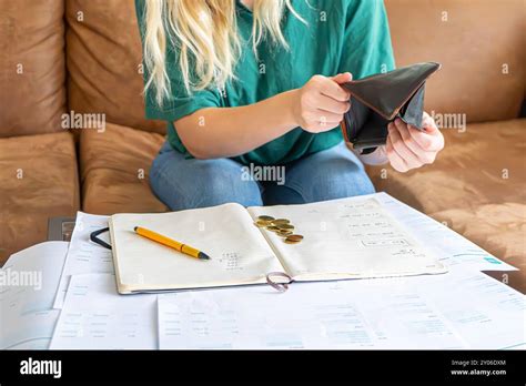 Blonde Girl With Financial Problems Girl Doing Taxes Bills And Invoices On The Table