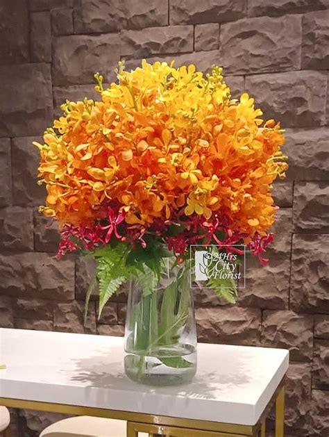 Orange Orchids Arrangements