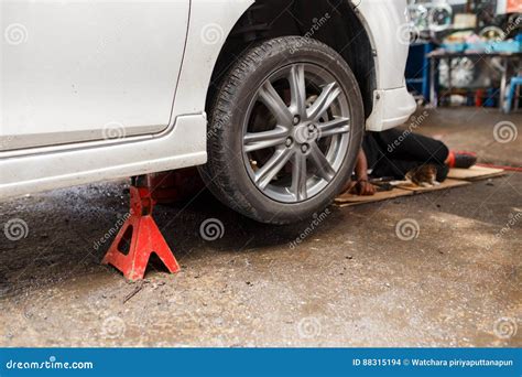 Jacking Up A Car To Change A Tire. Replacing Car Wheel Using Hydraulic ...