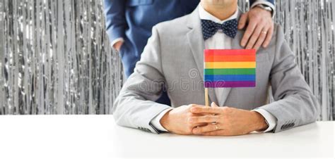Close Up Of Male Gay Couple Holding Rainbow Flag Stock Photo Image Of Curtain Gender