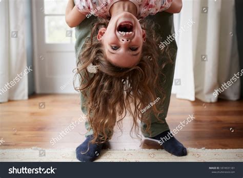 Girl Being Held Upside Down By Stock Photo 1874931181 | Shutterstock