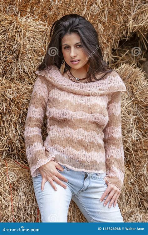 A Lovely Brunette Model Posing Outdoors With The Latest Fashions Stock Photo Image Of Books