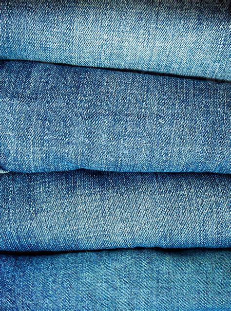 Pile of blue jeans, fabric texture 15716977 Stock Photo at Vecteezy