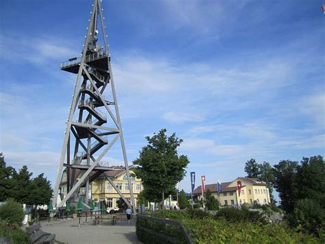 A Tall Metal Tower Sitting In The Middle Of A Park