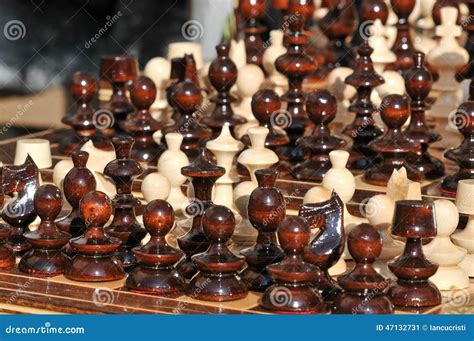 Black And White Chess Pieces On A Chessboard Closeup Set Of Chess