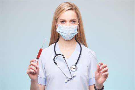 Premium Photo Girl Doctor Holding Blood Sample In Syringe Blood Donor