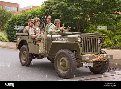 Reenactment Of World War Ii Jeep And Infantrymen Driving In 1940s Style