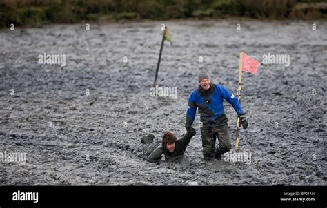 A Competitor is pulled out of the mud during the Maldon Mud Race. Picture by James Boardman ...