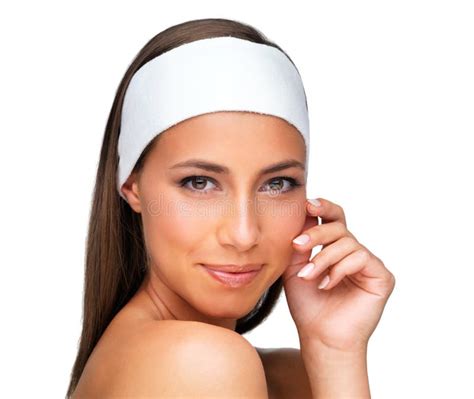 She Takes Skincare Seriously Studio Shot Of A Beautiful Brunette Woman On White Stock Image