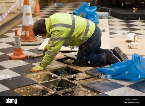 Workman Working Of The Floor Tiles In A Church Hi Res Stock Photography