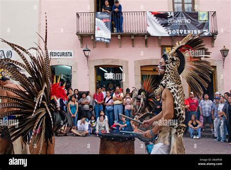 An AZTEC DANCE TROUPE performs in traditional feathered COSTUMES at the ...