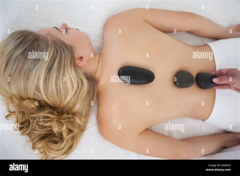 Beautiful Blonde Enjoying A Hot Stone Massage Stock Photo Alamy
