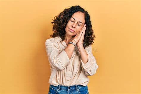 Middle Age Hispanic Woman Wearing Casual Clothes Sleeping Tired