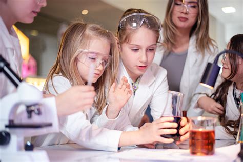 Elementary School Children Doing Experiments In The Laboratory Stock ...