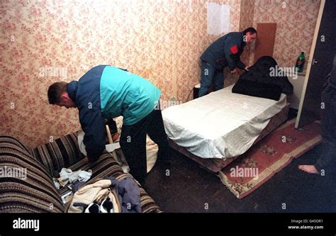 Merseyside Police Officers Carry Out A Search On A Flat In The Citys Bootle Area In An Early