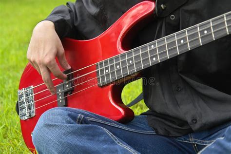 Man Playing The Bass Guitar Stock Photo Image Of Outside Metal